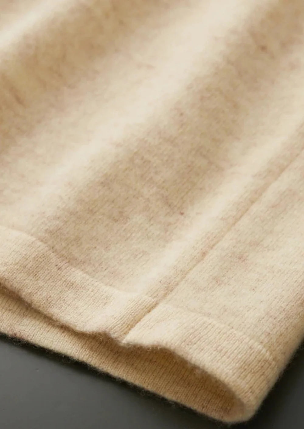 POLO CARDIGAN VAN ZUIVERE EXTRA FIJNE MERINOWOL